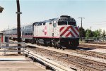 Commuter train shoves west out of the station